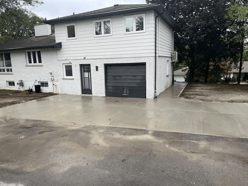Steel form work set up for concrete driveway installation in Brantford
